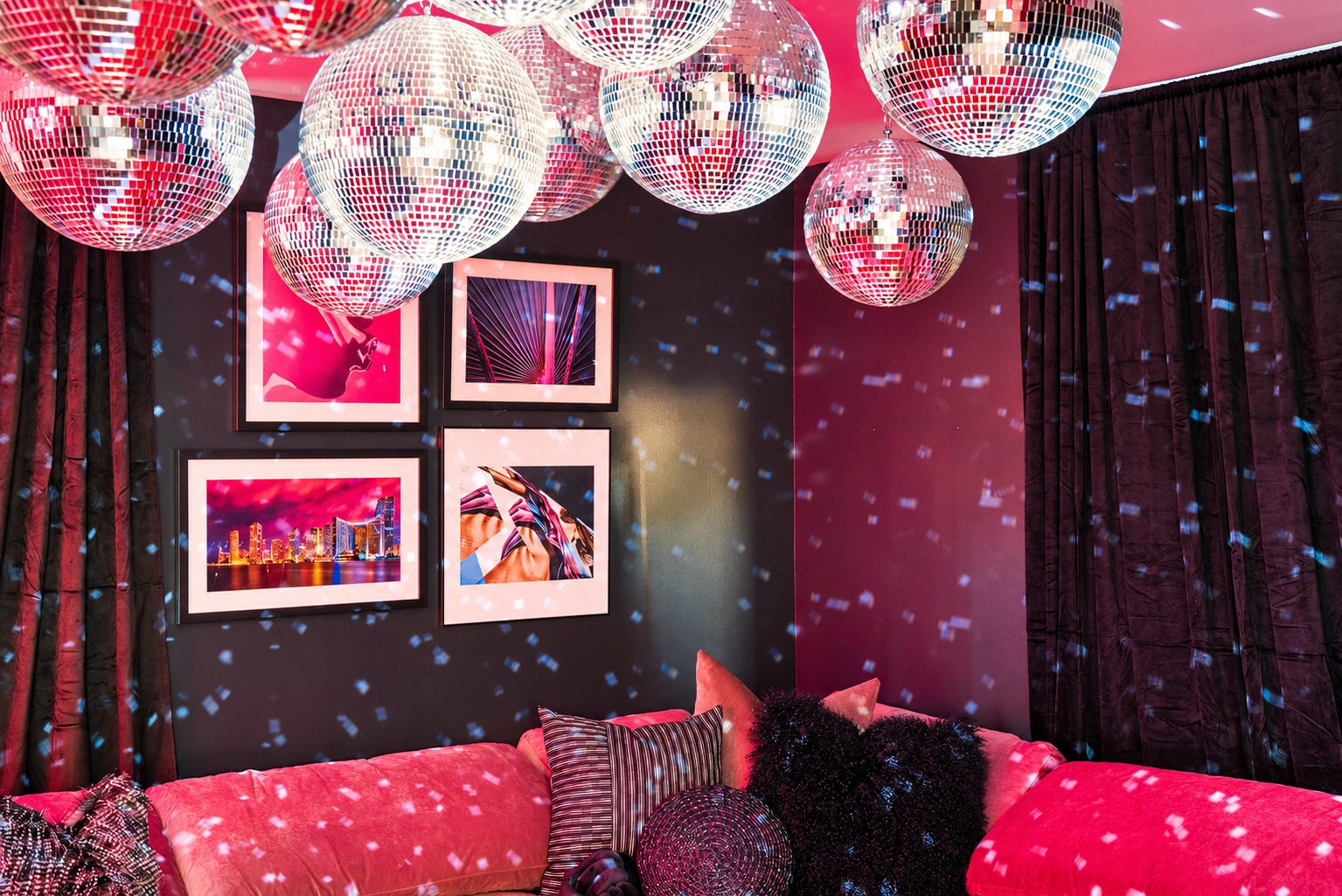 Karaoke room with disco balls and neon lighting